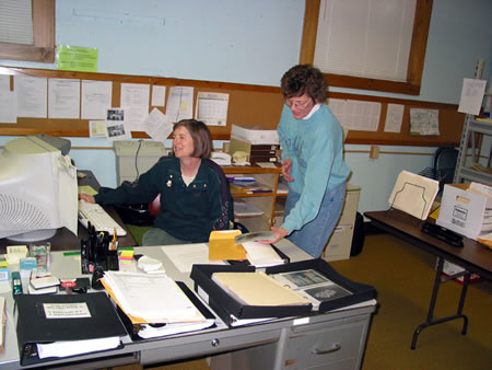 Janet Geronime and Pat Juday at work organizing archival images.